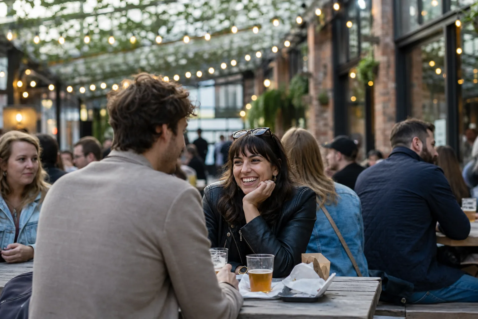 Two people talking over coffee in Manchester city centre