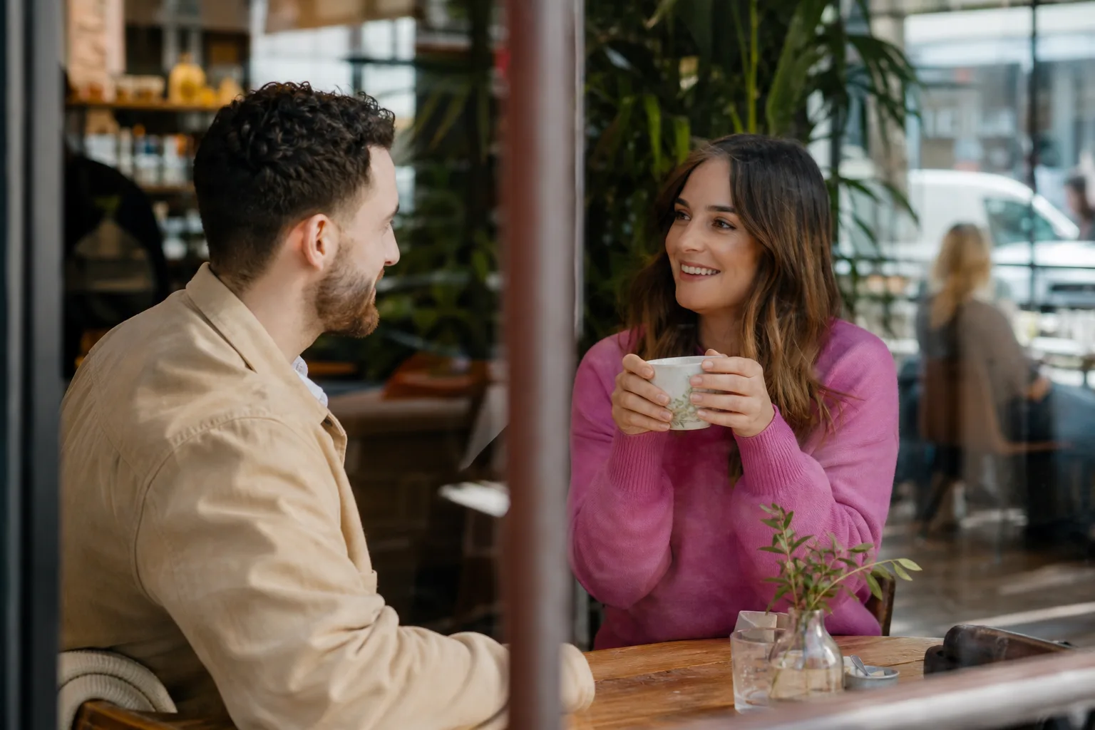Two Manchester singles talking over coffee in the city centre