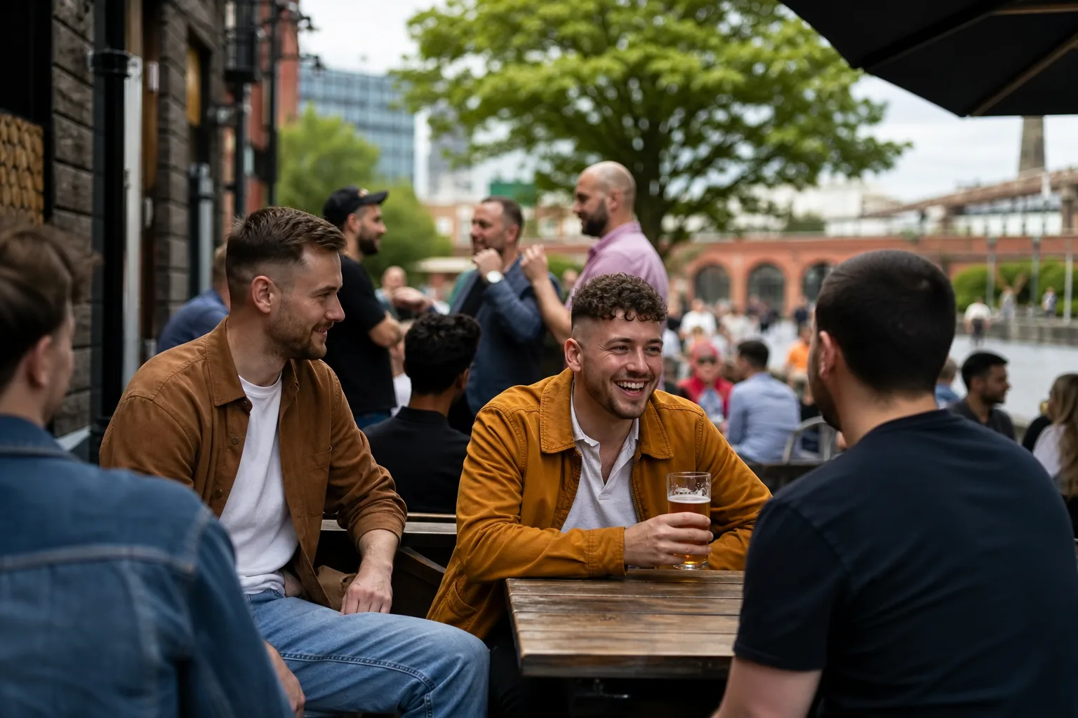 Two men chatting beside the canal in central Manchester